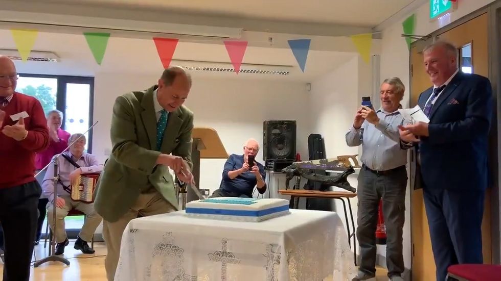 Prince Edward cuts cake