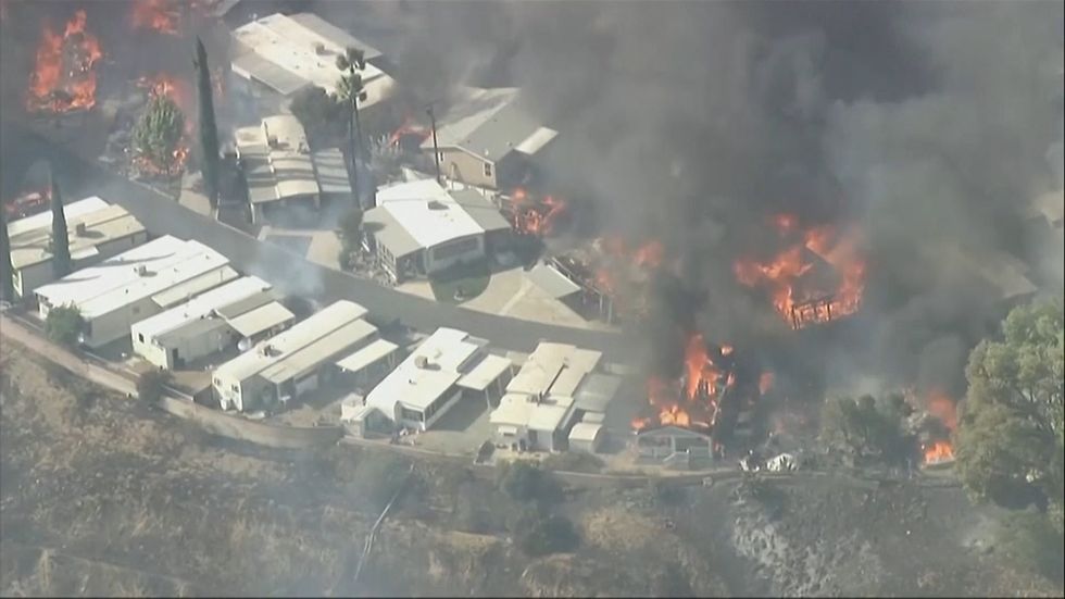 Wind-driven fires threaten California homes