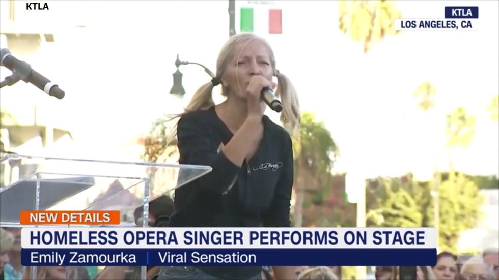 Homeless subway singer Emily Zamourka performs at Little Italy celebration