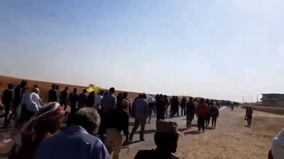 Thousands of people in Syria gather to protest against possible Turkish military incursion