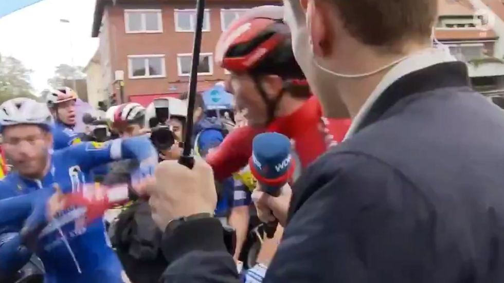 Belgian cyclist punches rival after crash