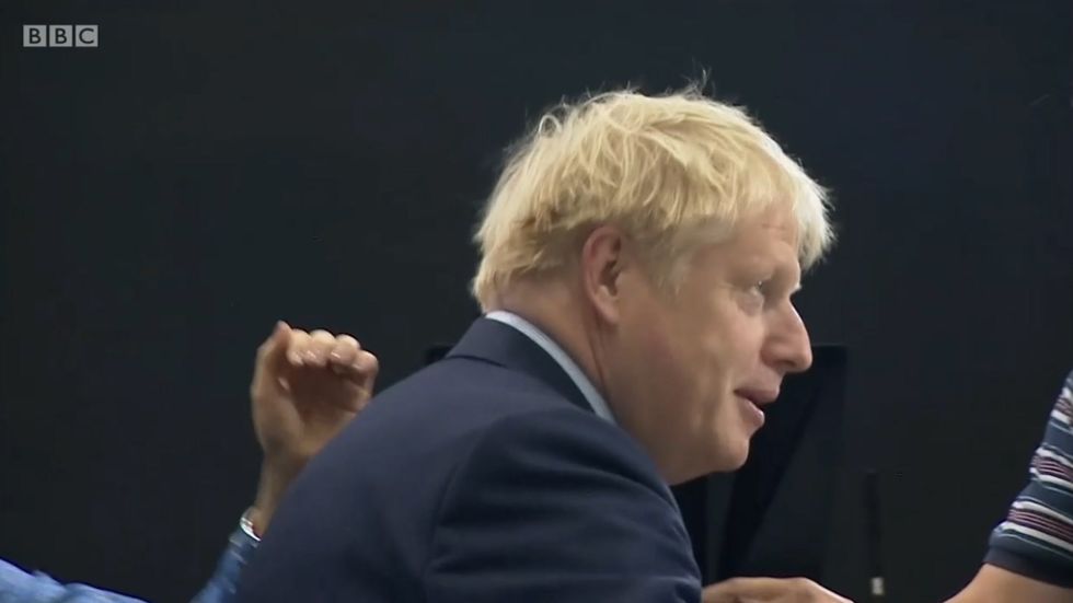 Boris Johnson murmurs 'boingy boingy boingy' as he gets his hair brushed