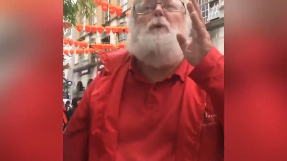 Woman confronts man in central London after he takes photos of her legs 