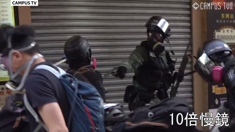 Man shot in chest as police fire live rounds at Hong Kong protesters
