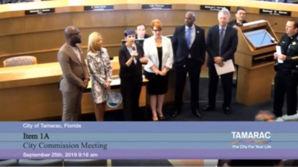 Florida official confronts police officer during awards ceremony