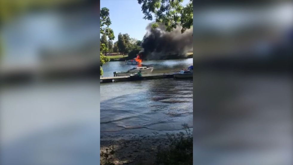 Boat is engulfed in flames shortly after 'exploding' on River Thames near Twickenham