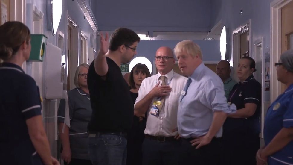 Angered parent confronts Boris Johnson at hospital over NHS cuts