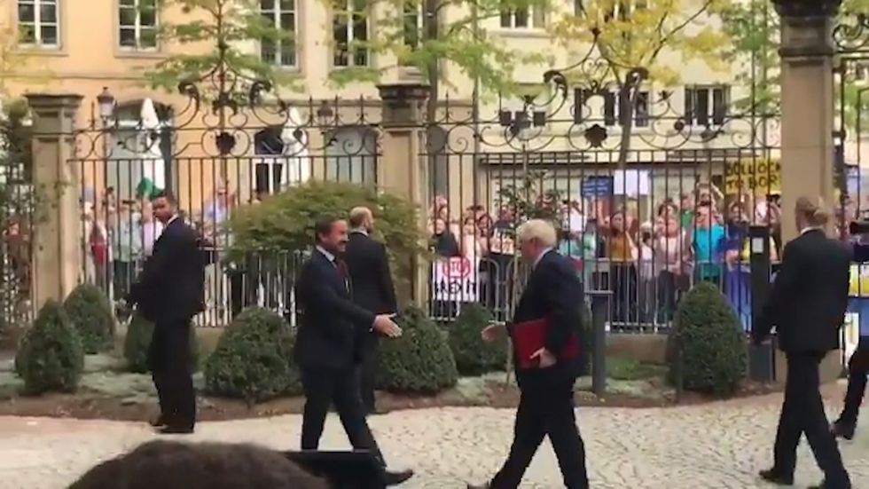 Boris Johnson is booed again as he arrives for talks with Luxembourg's Prime Minister Xavier Bettel