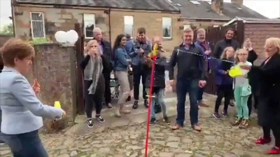Nicola Sturgeon accidentally hit in the head while playing swingball in Glasgow