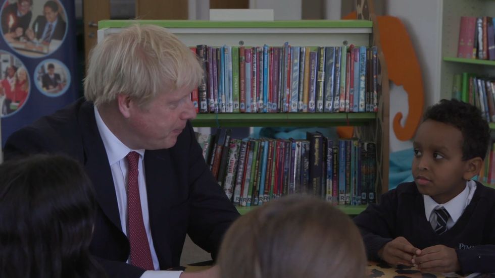 'Are we leaving with a deal or no deal?' Boris answers to young boy at school in Pimlico 