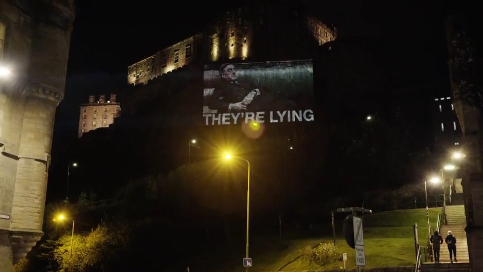 Image of Jacob Rees-Mogg projected onto Edinburgh Castle