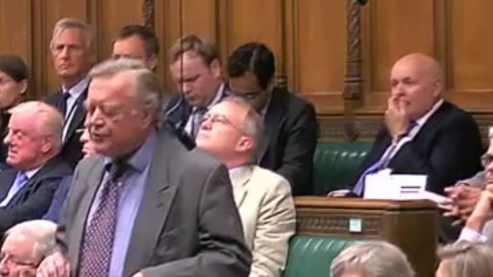 Iain Duncan Smith picks his nose and eats it during Commons debate