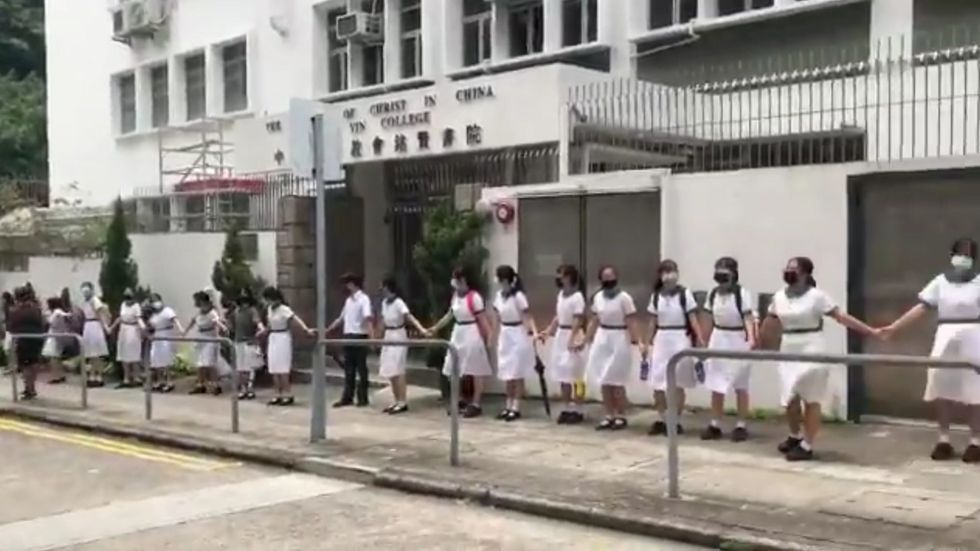 Students form human chain outside Hong Kong school in protest