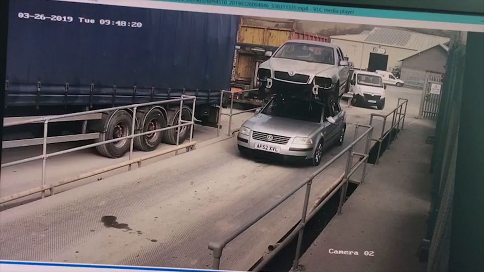 Man fined after driving a car with another car on its roof