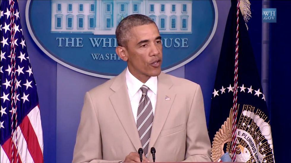 Barack Obama wears tan suit by tailor Georges de Paris at White House briefing in 2014