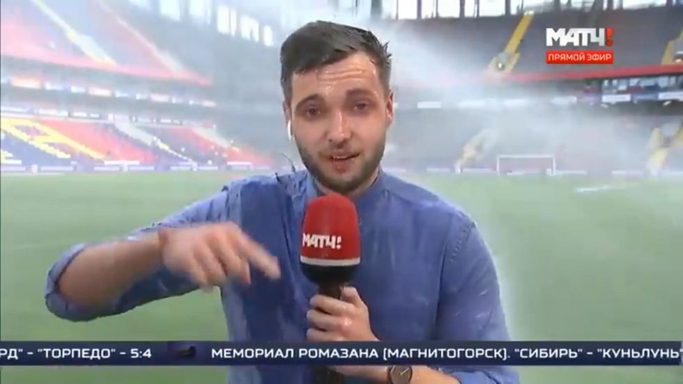 Russian sports journalists gets soaked during live broadcast
