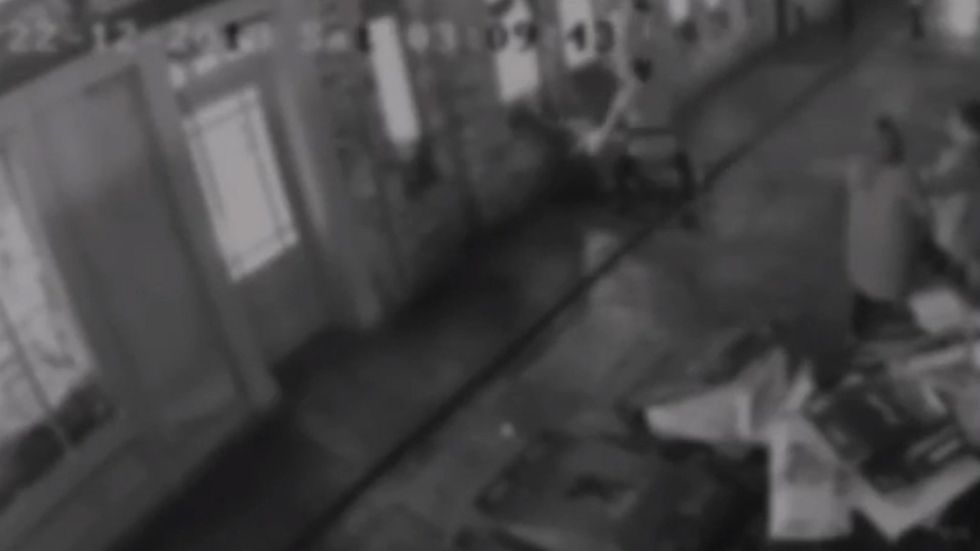 Bouncer throws man across street into wall in shocking CCTV
