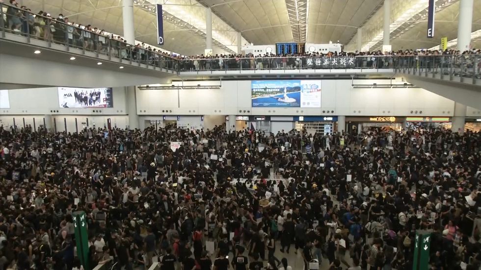 Protesters occupy Hong Kong Airport