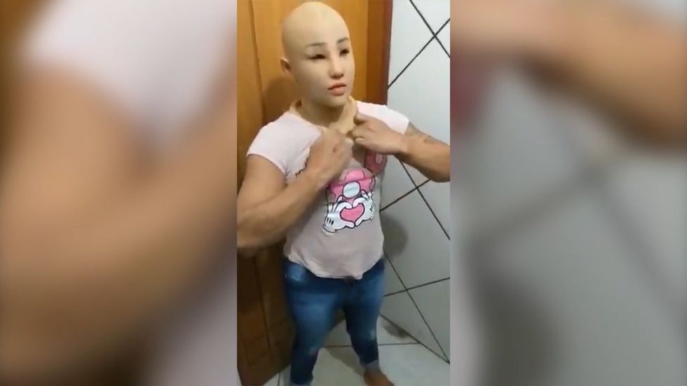 Brazilian gang leader removes mask after trying to escape from prison by dressing up as his daughter