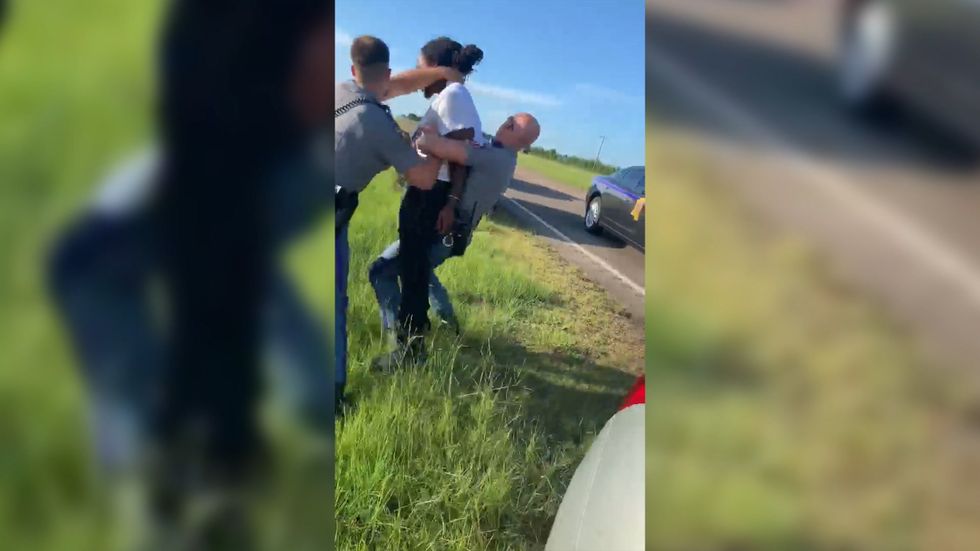 Police officer grabs black motorist by the neck during violent arrest