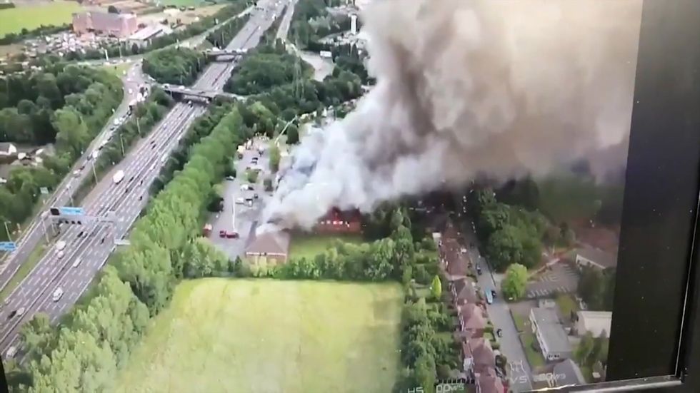 Firefighters tackle huge blaze at Holiday Inn