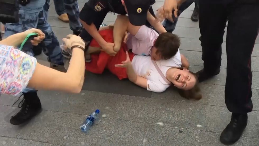 Russian protesters beaten by police remain defiant