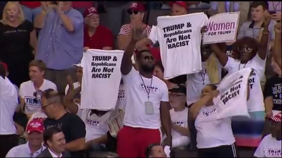 Trump crowd applauds black supporters at rally