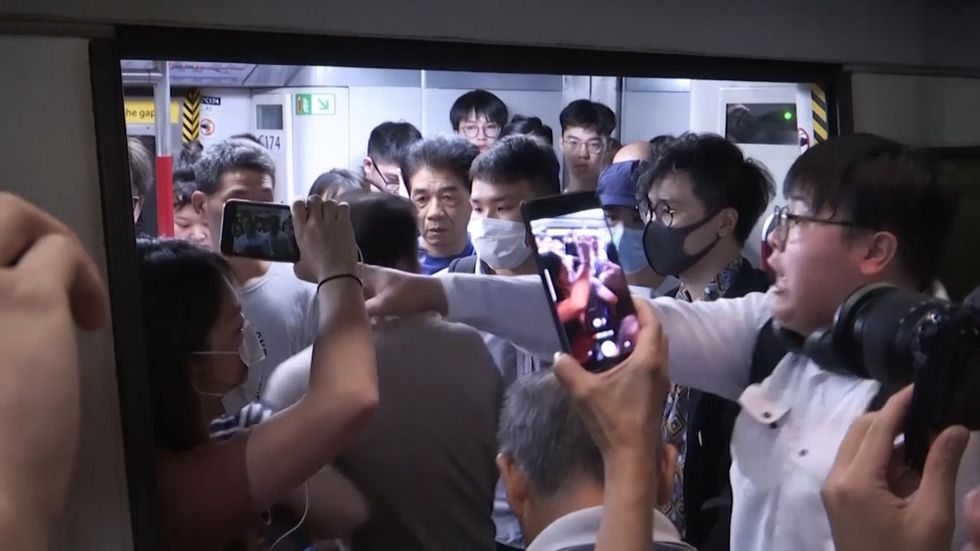 Hong Kong protesters disrupt morning train commute