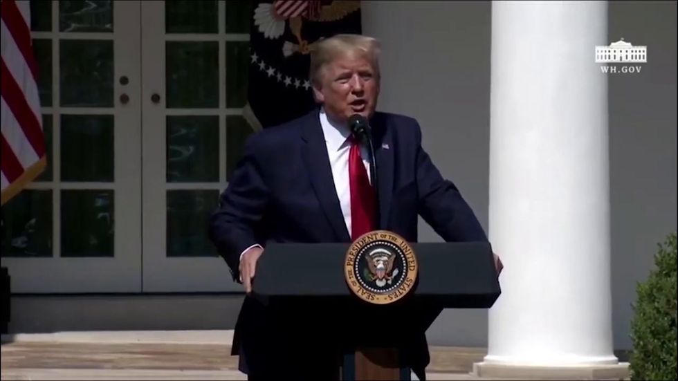 Donald Trump jokes about stage collapsing as he invites 9/11 victims' families first responders up for bill signing