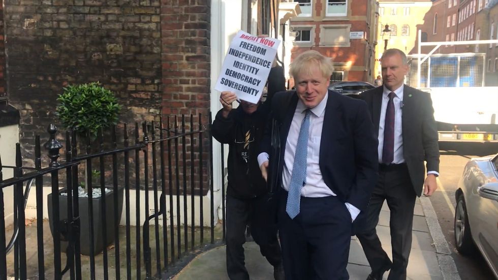 Boris Johnson arrives at his office as Tory leadership result looms