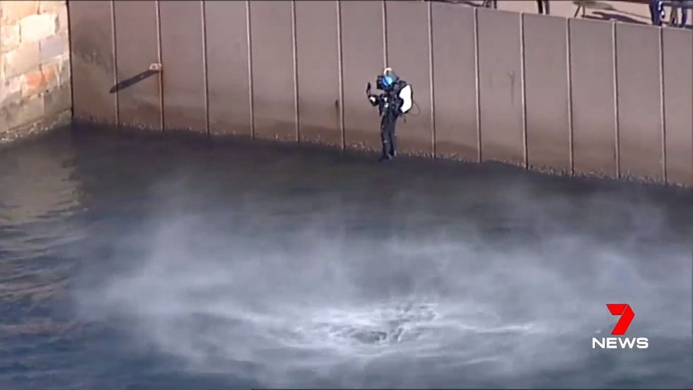 Man in jetpack flies across Sydney Harbour