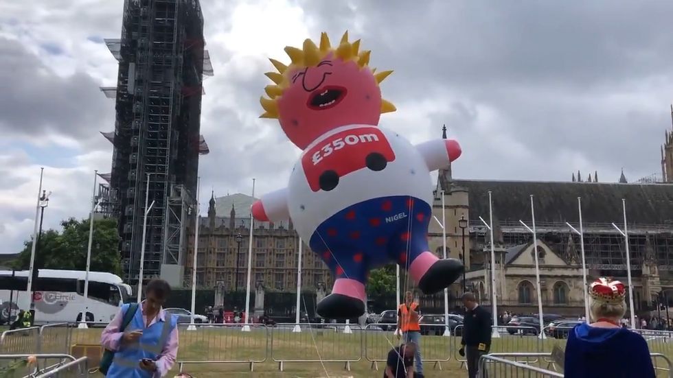 Boris Johnson blimp flies over Parliament Square as anti-Brexit protesters gather for major march