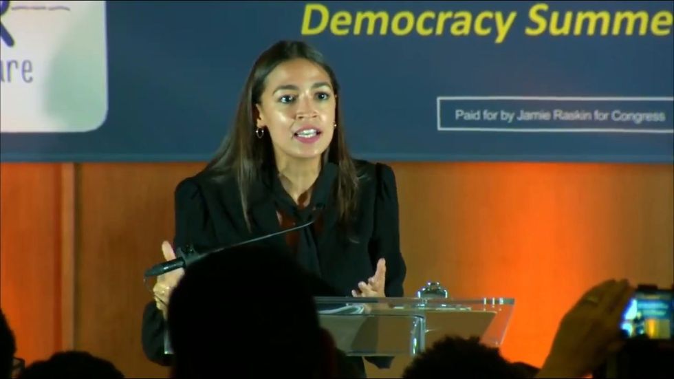 Alexandria Ocasio-Cortez tells rally: 'We will not go back we will go forward'