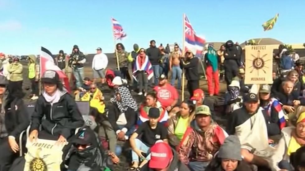 Elderly Native Hawaiians arrested protesting massive telescope on sacred mountain