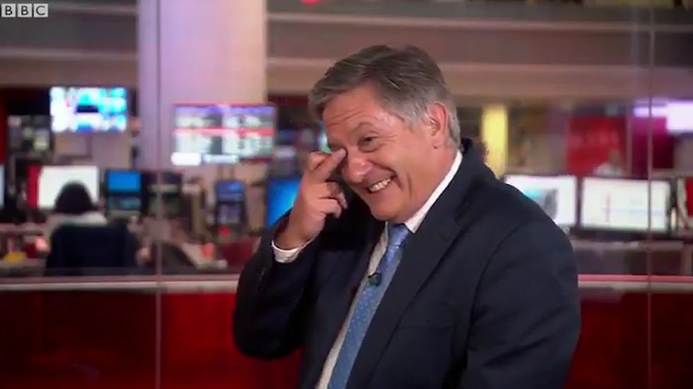 Simon McCoy cracks up at the mention of 'goat yoga' on BBC News