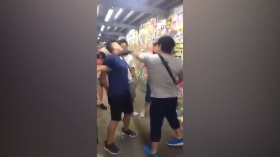 Activist remains calm after being repeatedly punched in face in Hong Kong assault