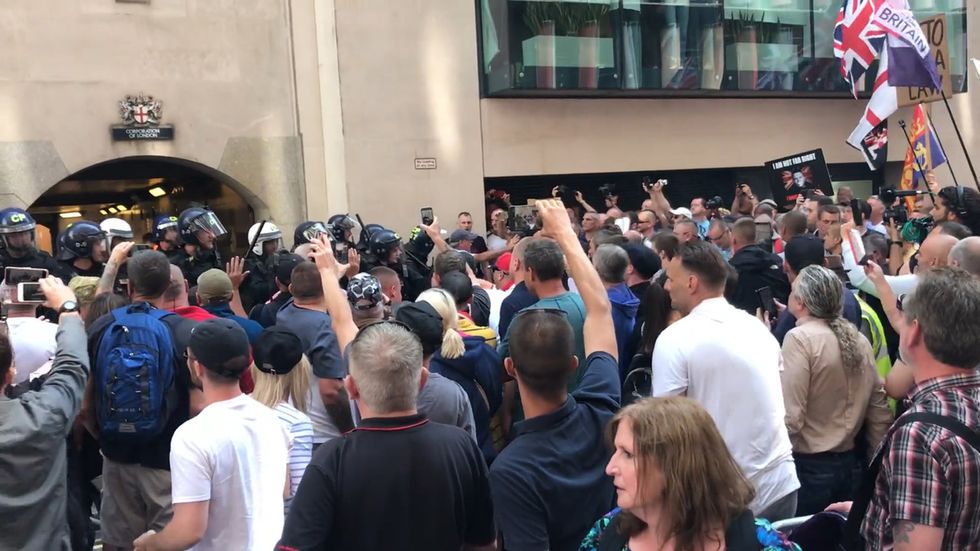 Tommy Robinson supporters confront police after his sentencing