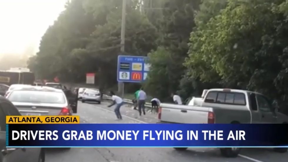 Armoured truck spills thousands of dollar bills onto Atlanta highway