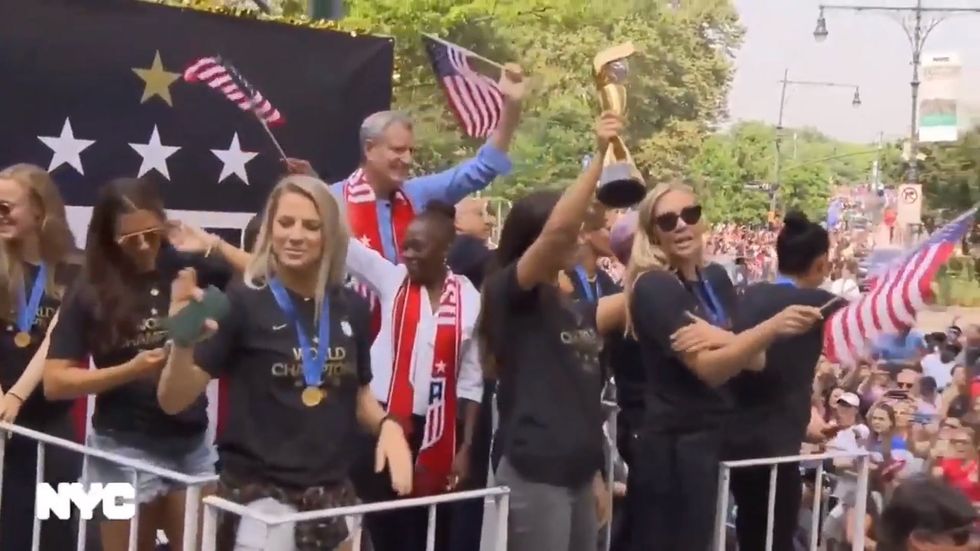 USA women's soccer team celebrate during ticker tape parade