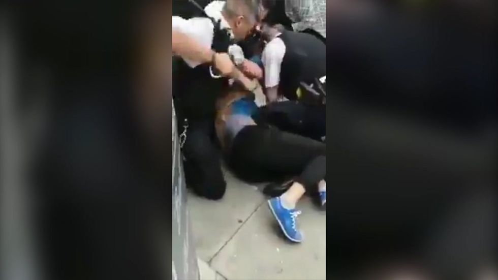 Police in London accused of brutality as shocking video shared online shows officers punching man with handcuffs