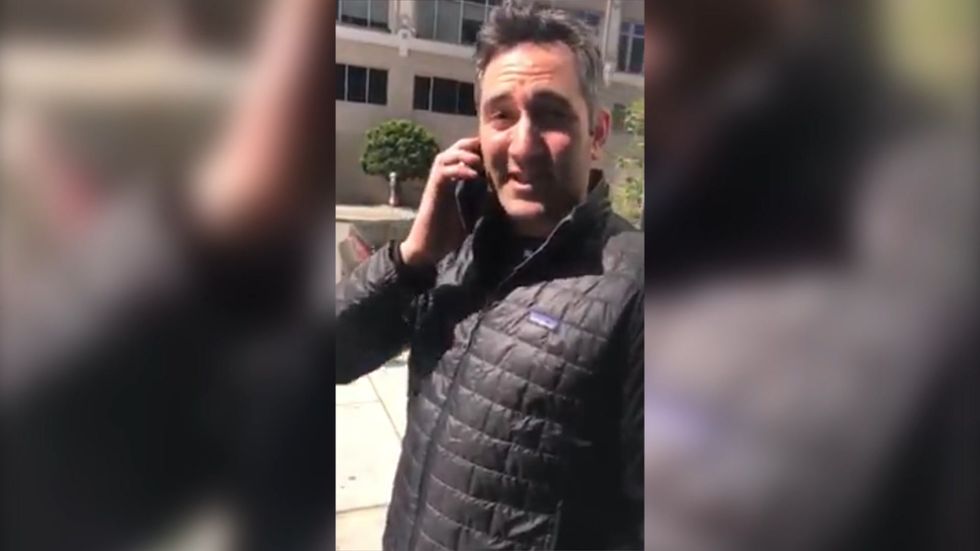 Son begs his father not to call the police on black man 'trespassing' whilst waiting for friend