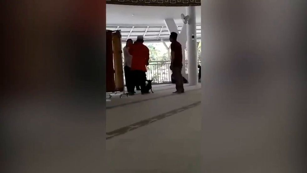 'Mentally ill' woman brings dog into mosque in Indonesia