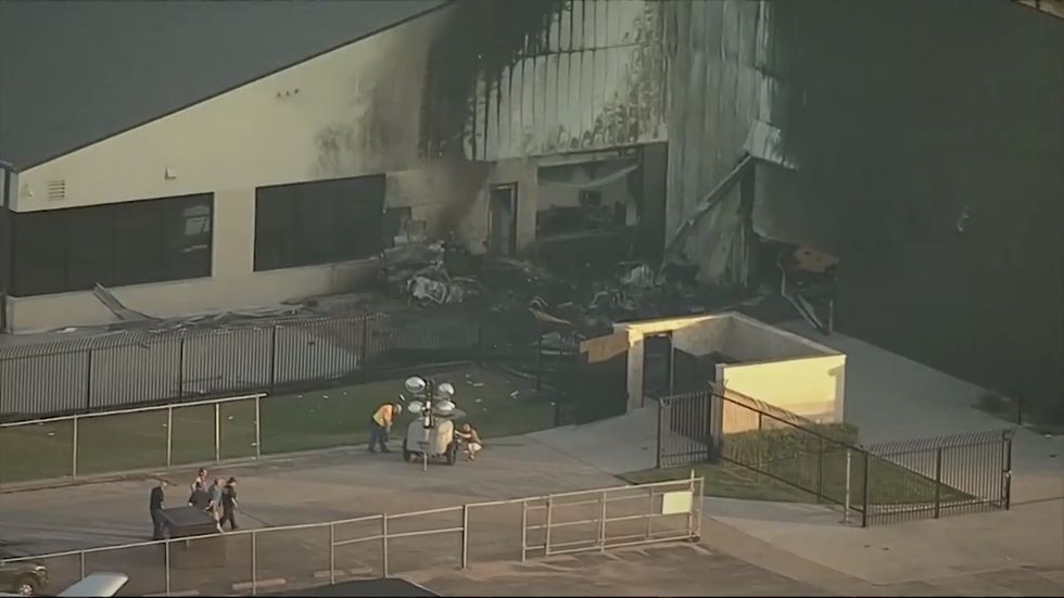 Plane crashes into aircraft hangar in Dallas, Texas in deadly accident