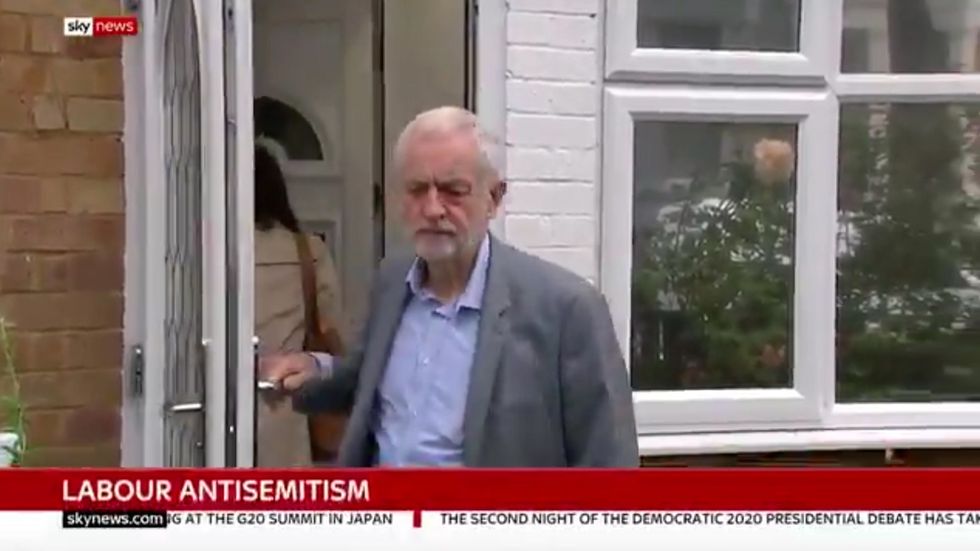Jeremy Corbyn appears to shut his wife inside their porch 