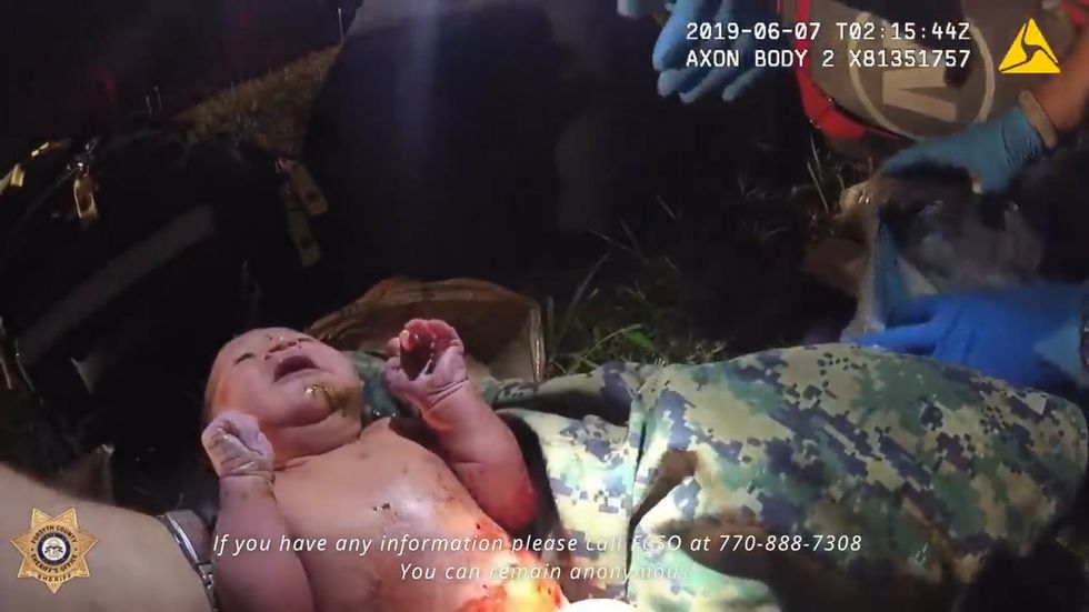 Officers rescue newborn baby tied up in plastic bag 