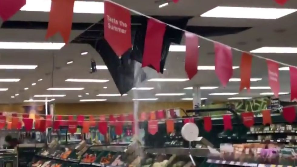 Water pours into Tesco supermarket aisles as ceiling collapses in heavy rain
