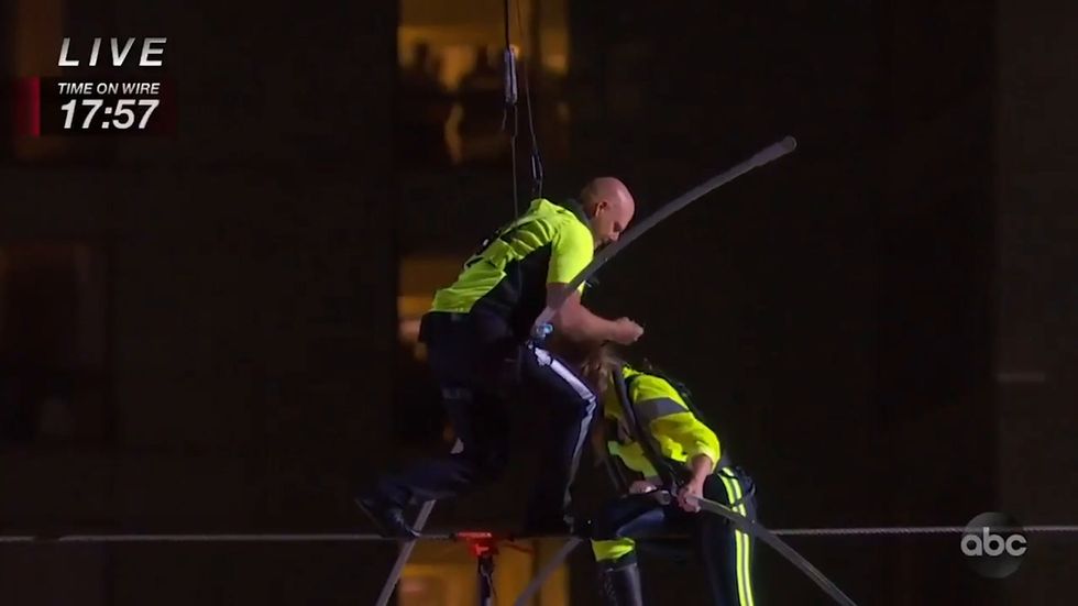 Nik and Lijana Wallenda walk on high wire above Times Square