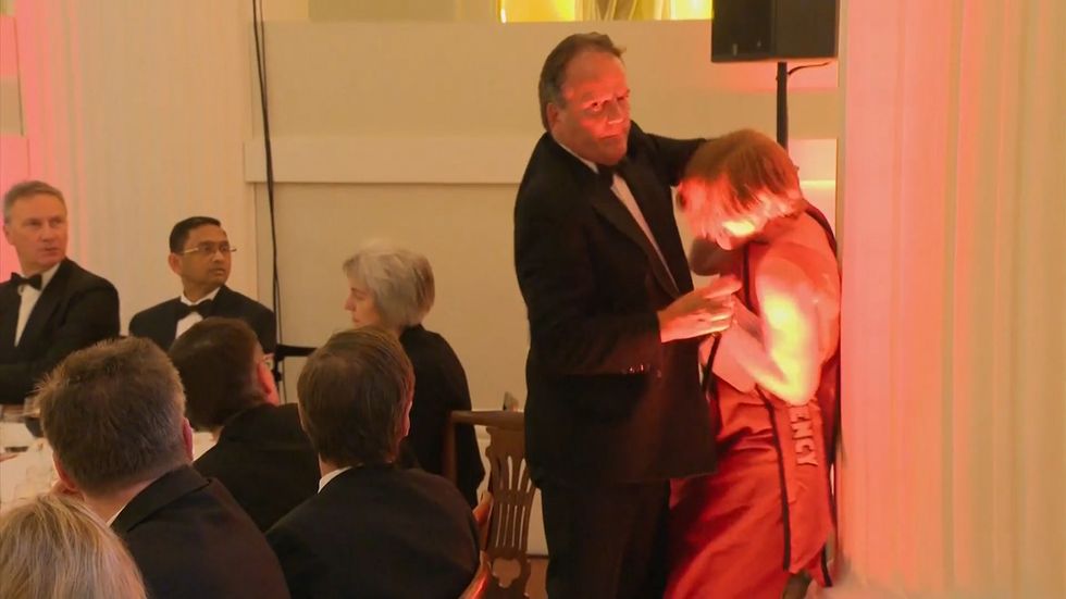 MP Mark Field slams woman against pillar at banquet