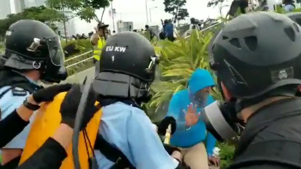 Hong Kong police officer repeatedly pepper sprays protest bystander