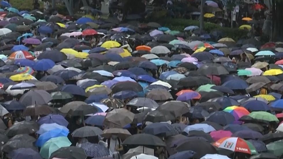 Thousands of protesters with umbrellas block entry to Hong Kong's government HQ 